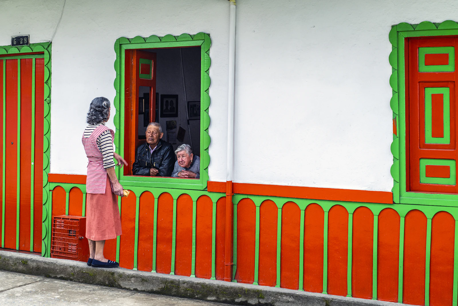 Side-by-side comparison of Filandia's quiet main square and Salento's busy colorful main street in Colombia's Coffee Region