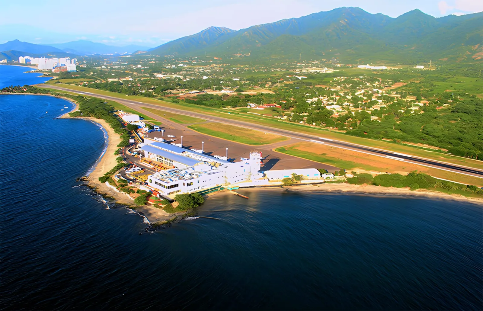 Aerial view of Simón Bolívar International Airport in Santa Marta, on the Caribbean coast with the Sierra Nevada mountains behind